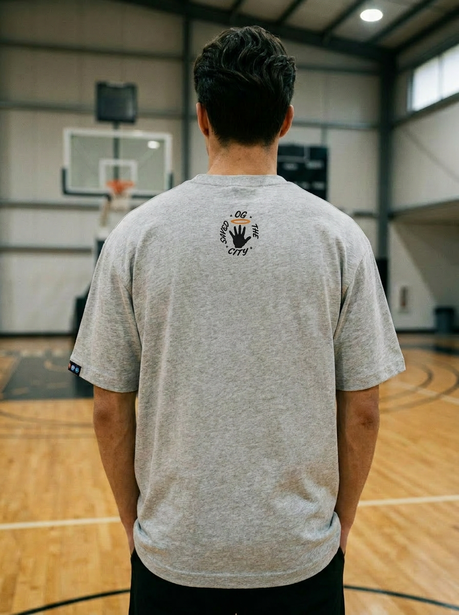 Model wearing the Hand of God Tee in Heather Grey — back artwork